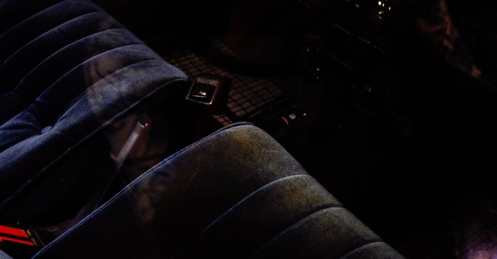 Close-up of a vintage car interior featuring plush seats and classic dashboard controls, perfect for automotive enthusiasts.